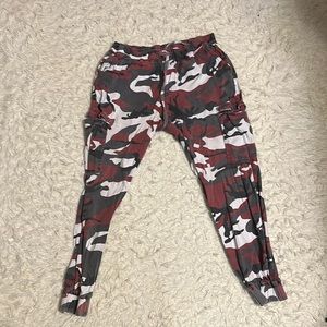 Almost Famous woman’s pants.  Size XLRed Gray and Black camouflage pants.